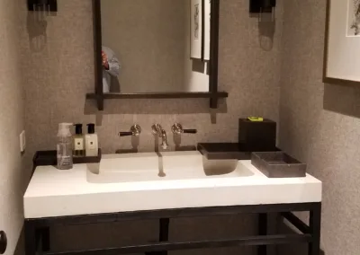 A bathroom with a sink and mirror.