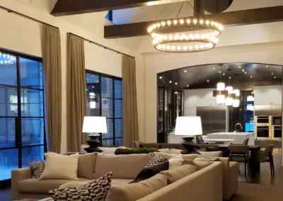 A large living room with a chandelier.