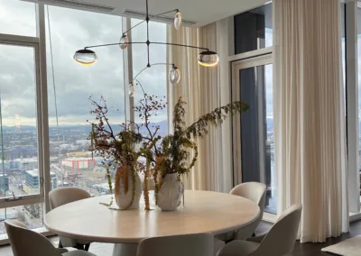A dining room with a view of the city.
